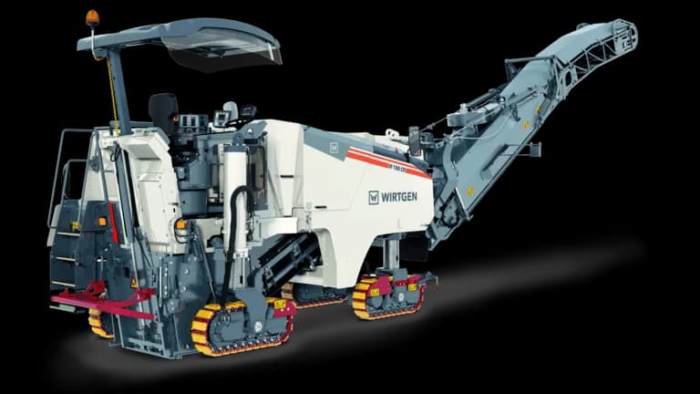 A front-angled shot of the W 130 HR on a job site, highlighting its operator platform, control console, and the machine's compact yet powerful build for medium-to-large milling operations.