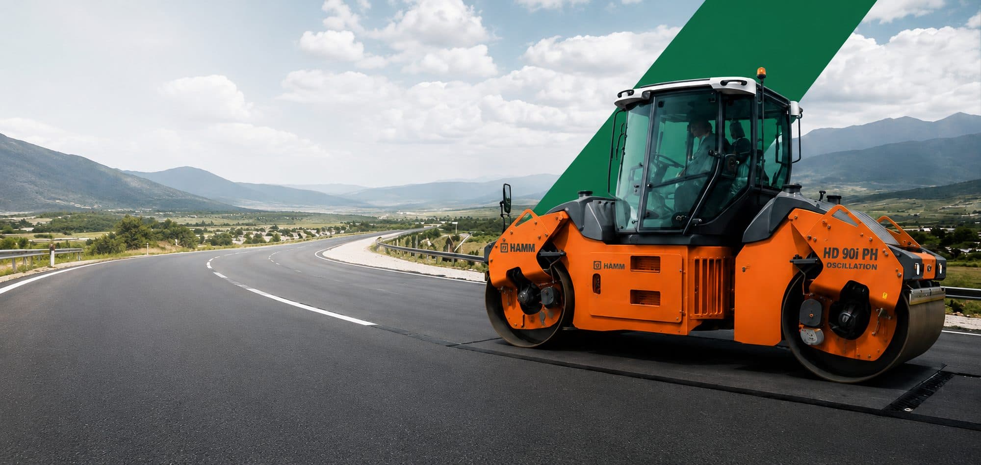 Hamm HD 90i PH tandem roller on a newly surfaced mountain highway