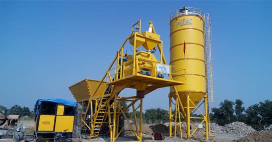 Apollo Inffratech ATP 75 compact concrete batching plant, highlighting its space-saving MS-frame design with integrated aggregate bins and mixing unit built for efficient mid-capacity concrete production.