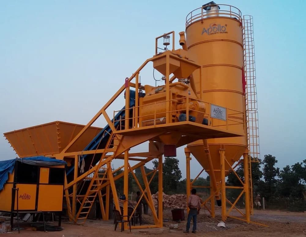 Fully automatic Apollo ATP 45 compact concrete batching plant on-site, featuring its 14-ton cement silo, aggregate hoppers, and streamlined mixing unit designed for efficient, space-saving concrete production.