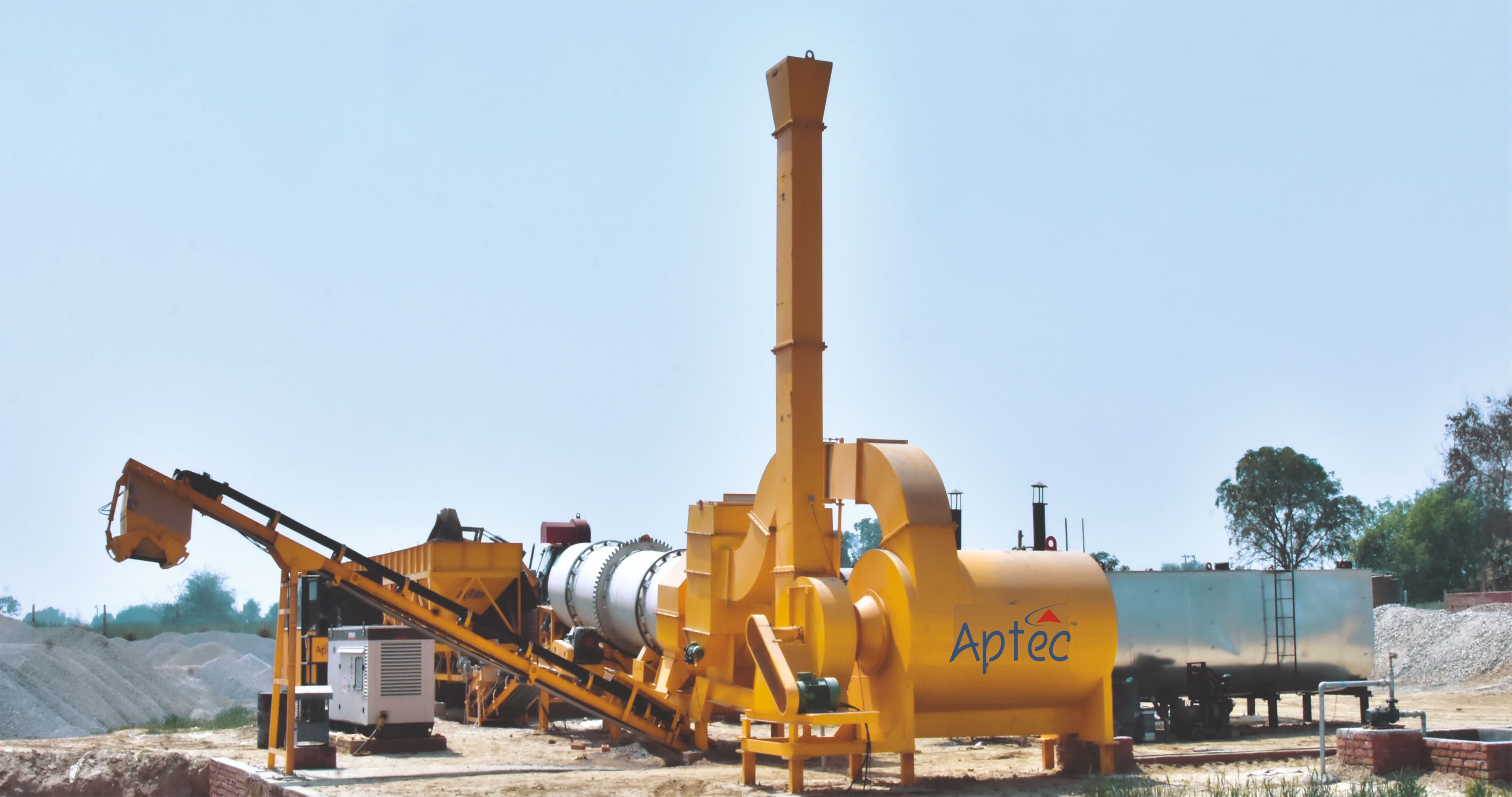 The Aptec DMP 50 is a stationary asphalt drum mixing plant with a 50 tph capacity, featuring an integrated dryer/mixer drum, aggregate feeding system, and bitumen storage, designed for efficient, continuous hot-mix asphalt production on road construction projects.