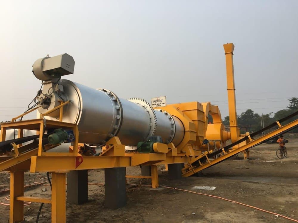 The Aptech DMP 60 is a semi-automatic stationary asphalt drum mix plant with a 60 tph capacity, featuring an integrated dryer/mixer drum, aggregate cold feed bins, and bitumen storage system, designed for efficient hot-mix asphalt production for industrial and road construction applications.