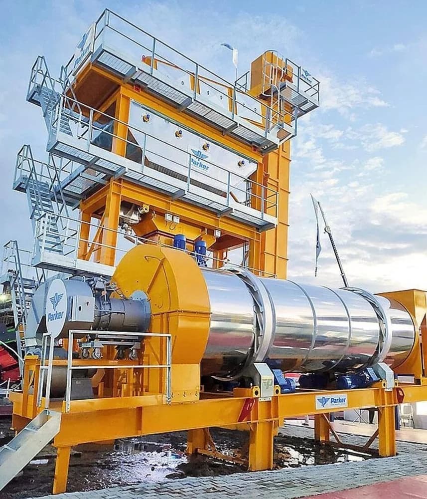 The Parker StarBatch 180 TPH is a high-capacity, fully automatic asphalt batch mix plant featuring a multi-tier tower design with drying drum, mixing tower, and bitumen/filler storage, engineered for large-scale, high-productivity hot-mix asphalt production on major road projects.